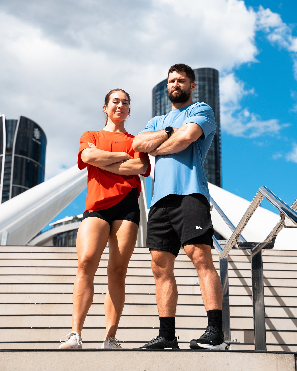 Legacy Oversize Tee in Core Blue - male model on city steps