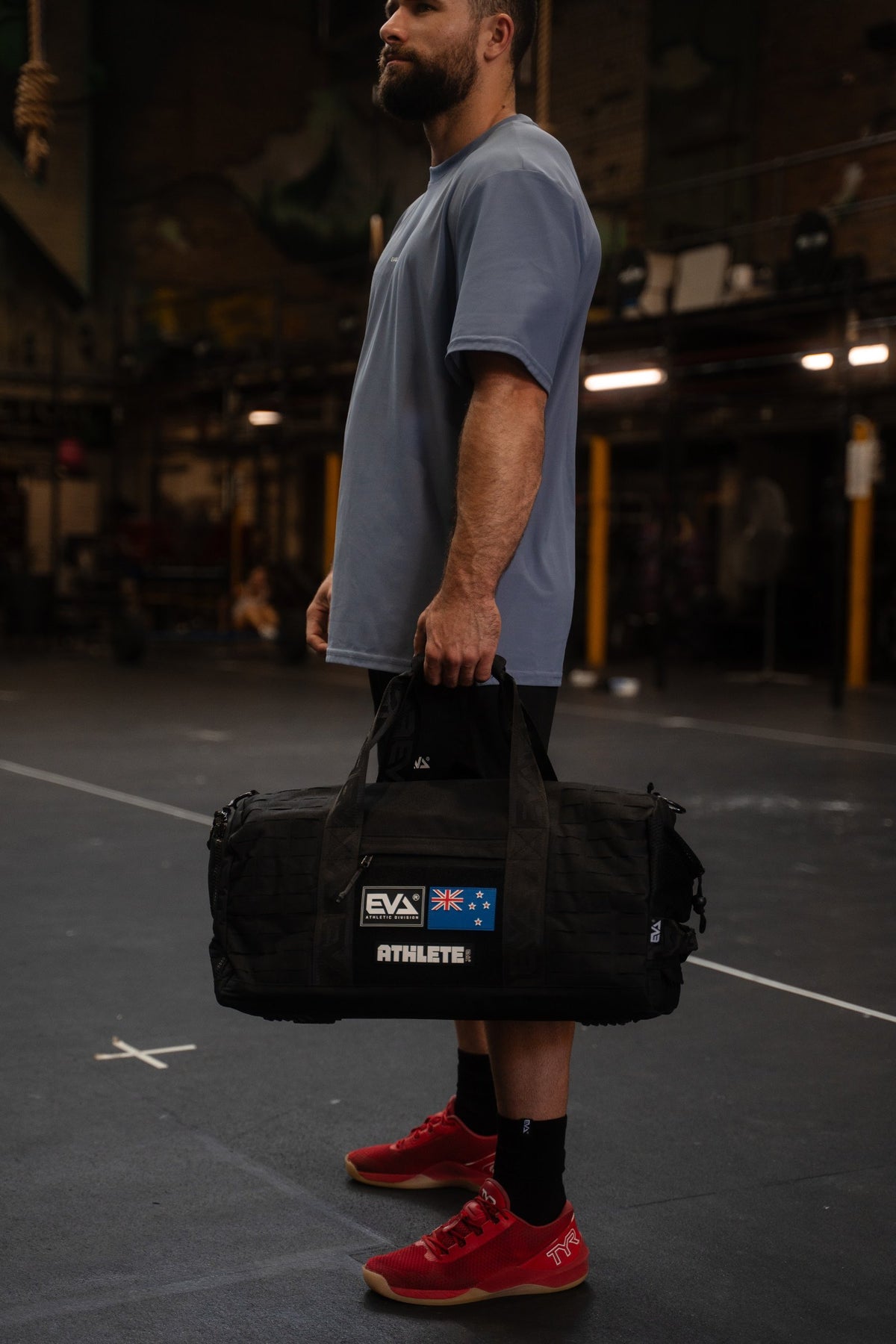 Bayley carrying the Black Elite Duffel