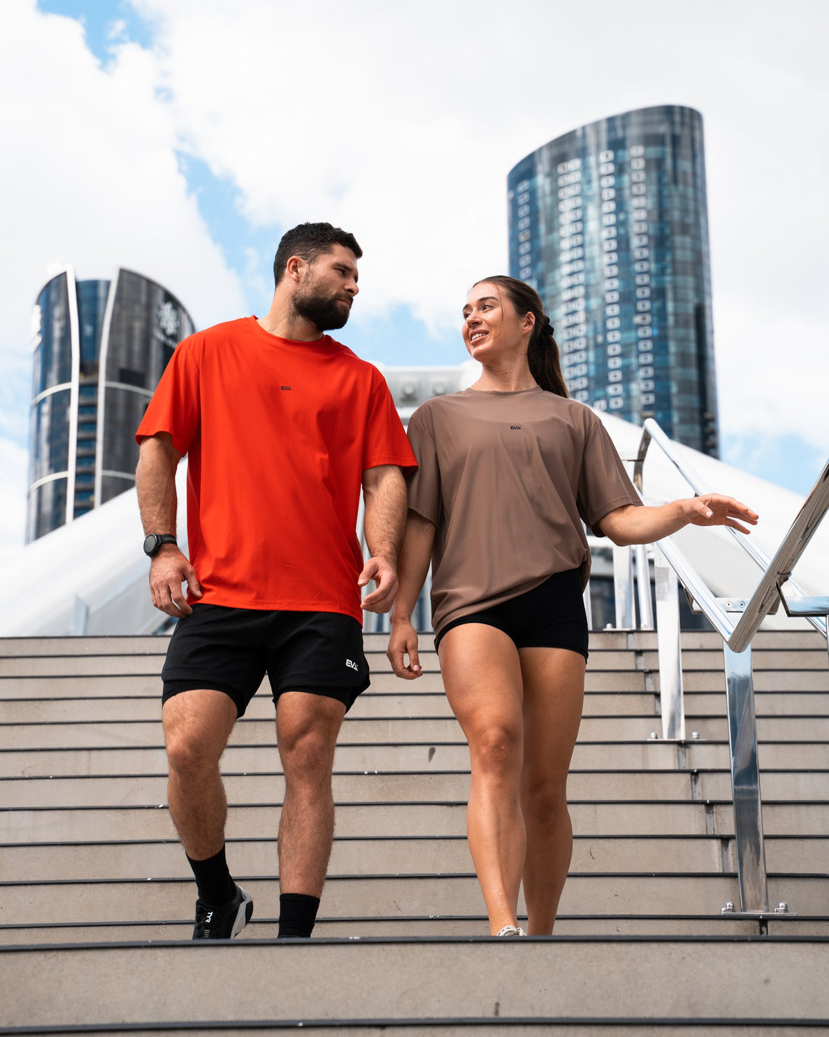 Legacy Oversize Tee in Crimson Red - male model walking down city steps