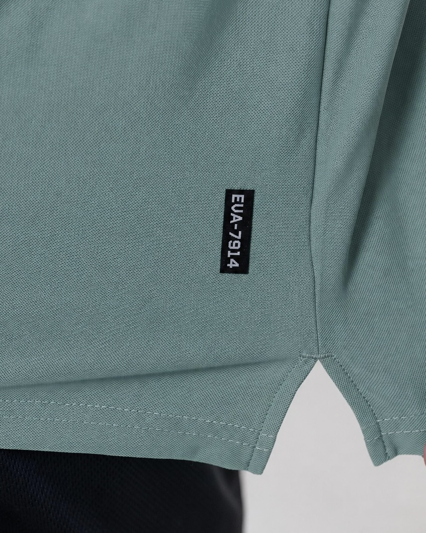 Legacy Oversize Tee in Dusty Teal - fabric and EVA-7914 hem tab detail